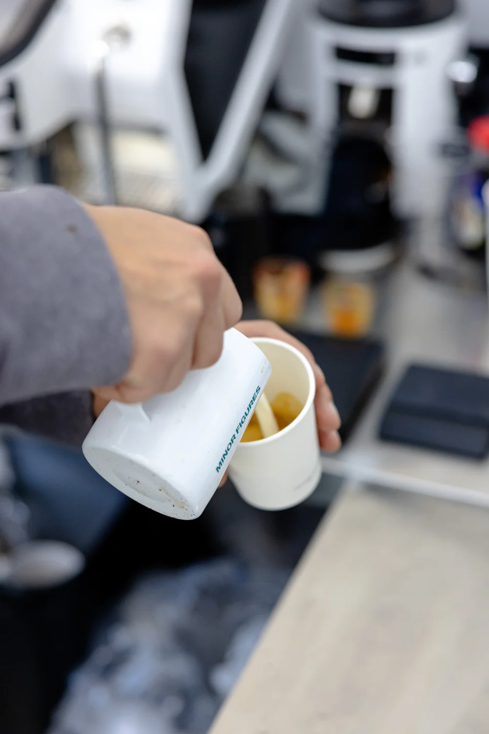 Milk poured into a cup of coffee at the espresso bar.